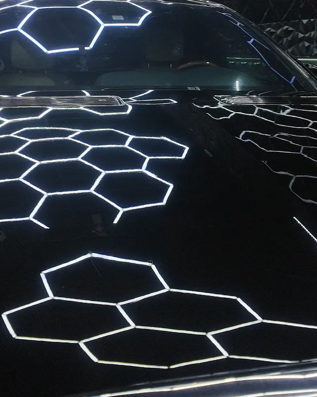 Black Mercedes S500 bonnet filled with hexagon light reflections after full-body clear gloss PPF at JU Riyadh Center