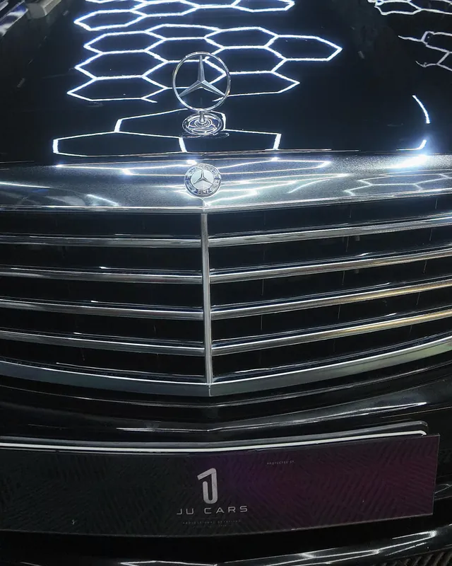 Chrome grille of a black Mercedes S500 after full-body clear gloss PPF at JU Riyadh Center