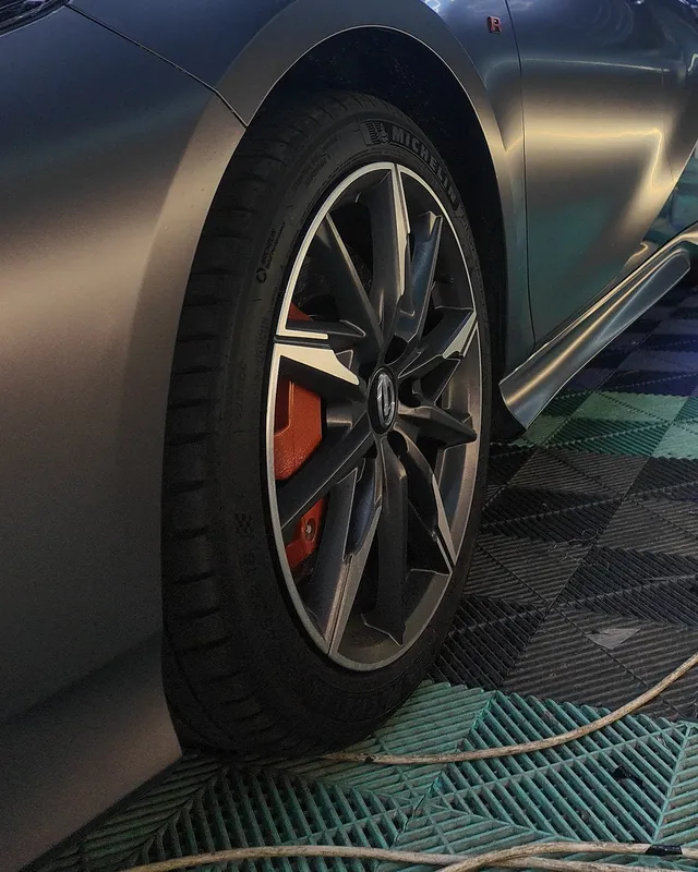GAC Empow R wheel and red brake caliper beside the matte body after full-body clear matte PPF at JU Riyadh Center