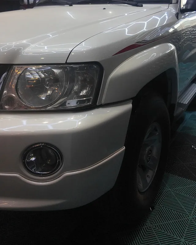 Nissan Patrol Super Safari in its original white before the color change to gloss black with PPF film at JU Riyadh Center