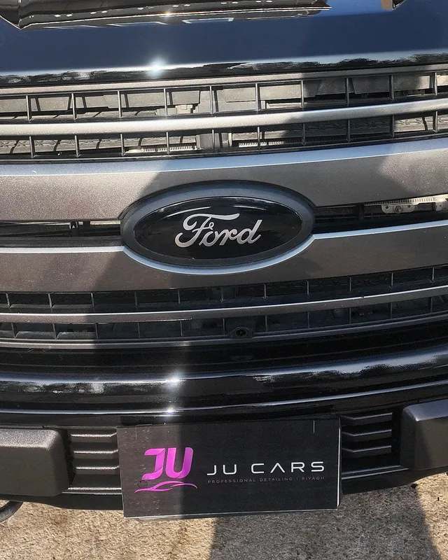 Ford F-150 front after a color change from white to gloss black with PPF film at JU Riyadh Center