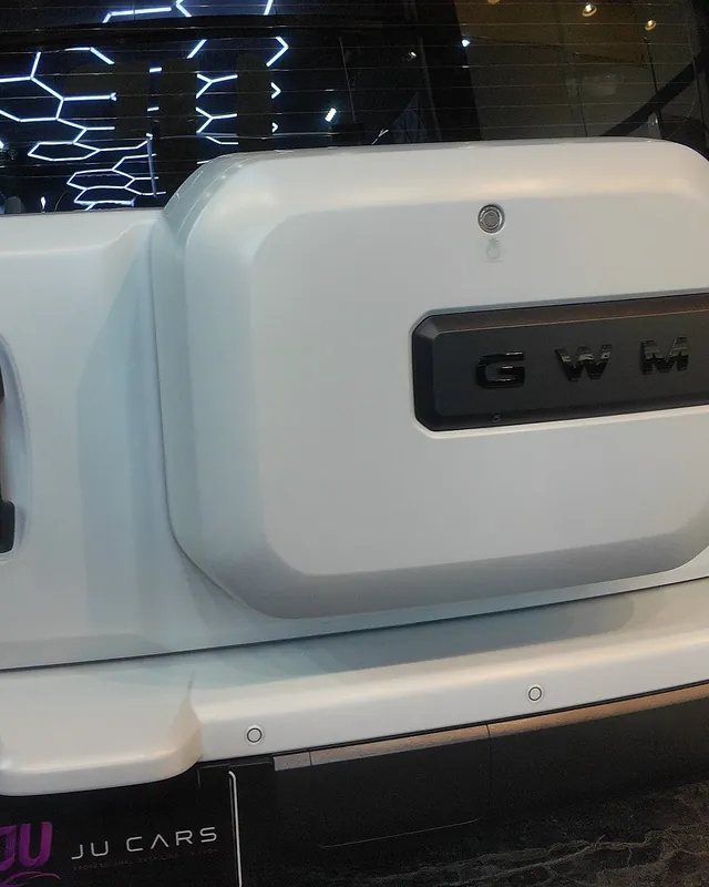 Rear of a matte white Haval H9 with the hexagon lights in its glass, full-body clear matte PPF at JU Riyadh Center